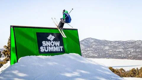 Skier doing a trick on a feature