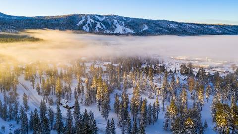 Foggy morning from a drone view overlooking Big Bear Lake and the ski resorts
