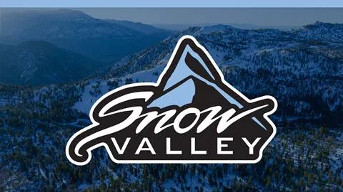 Blue overlay on a snow covered mountain top image with the Snow Valley logo